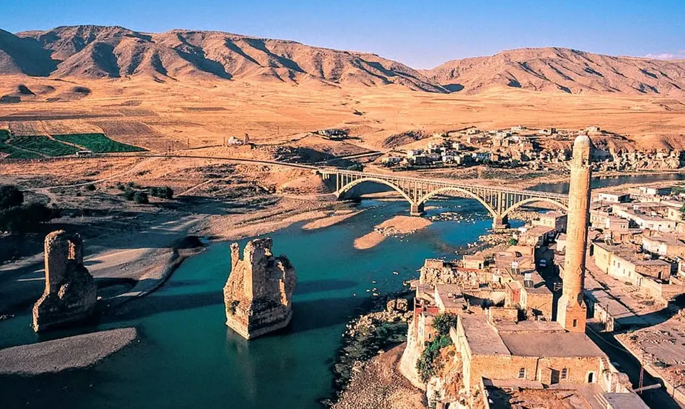 Historic buildings on a riverbank, aerial view